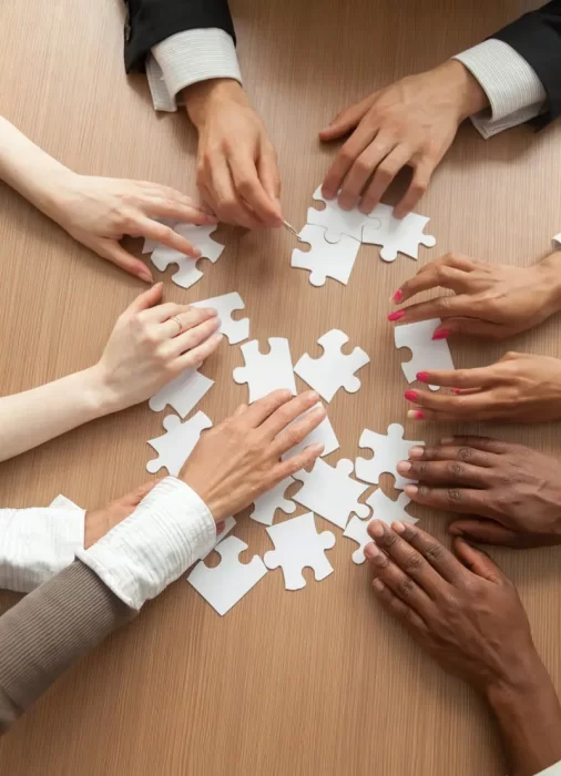 hands-assembling-puzzle-portrait